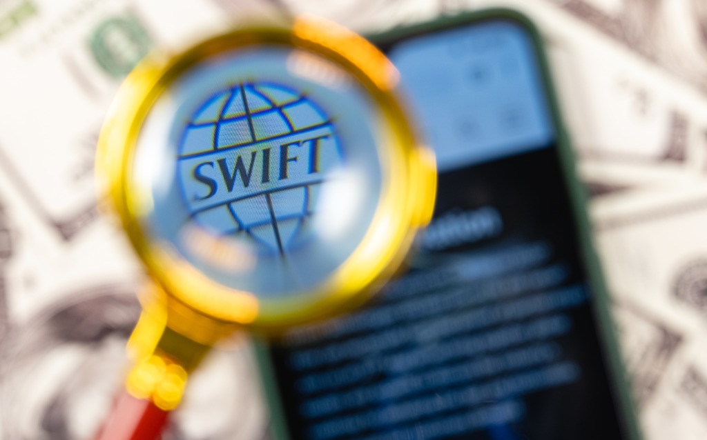 What is SWIFT and what is its role in payments?
